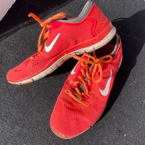 Nike Free TR fit 4. Orange and grey. Still in great shape, no tears or damage